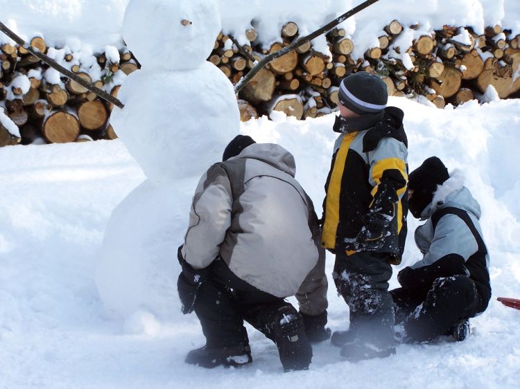 Kids building a snowman