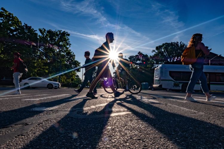 Students walking and biking on campus