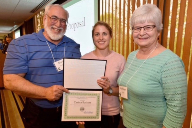 A Scriber scholar being presented their recognition at an Entomology Awards Ceremony.