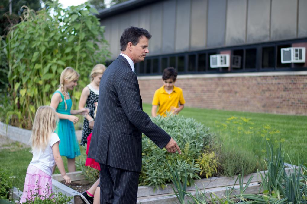 U.S. Representative Trott visits the Waterford School District Garden in 2015