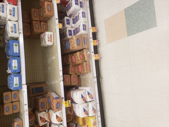Flour and sugar shelves at the grocery store